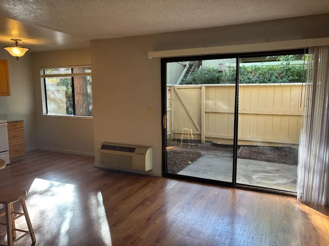 a view of livingroom with furniture and floor to ceiling window