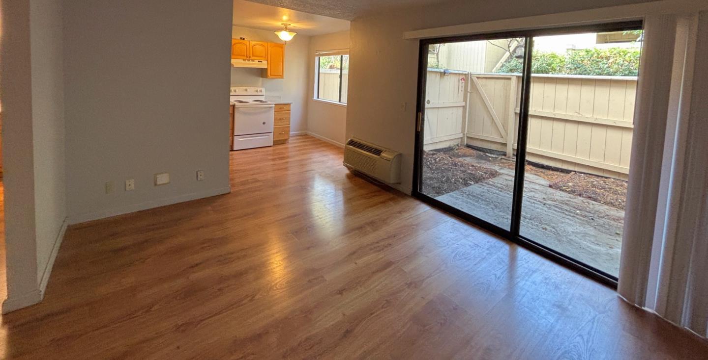 934 Kiely Boulevard, Unit B Santa Clara, CA 95051 - Photo 7 of 19 a view of a room with wooden floor and a window