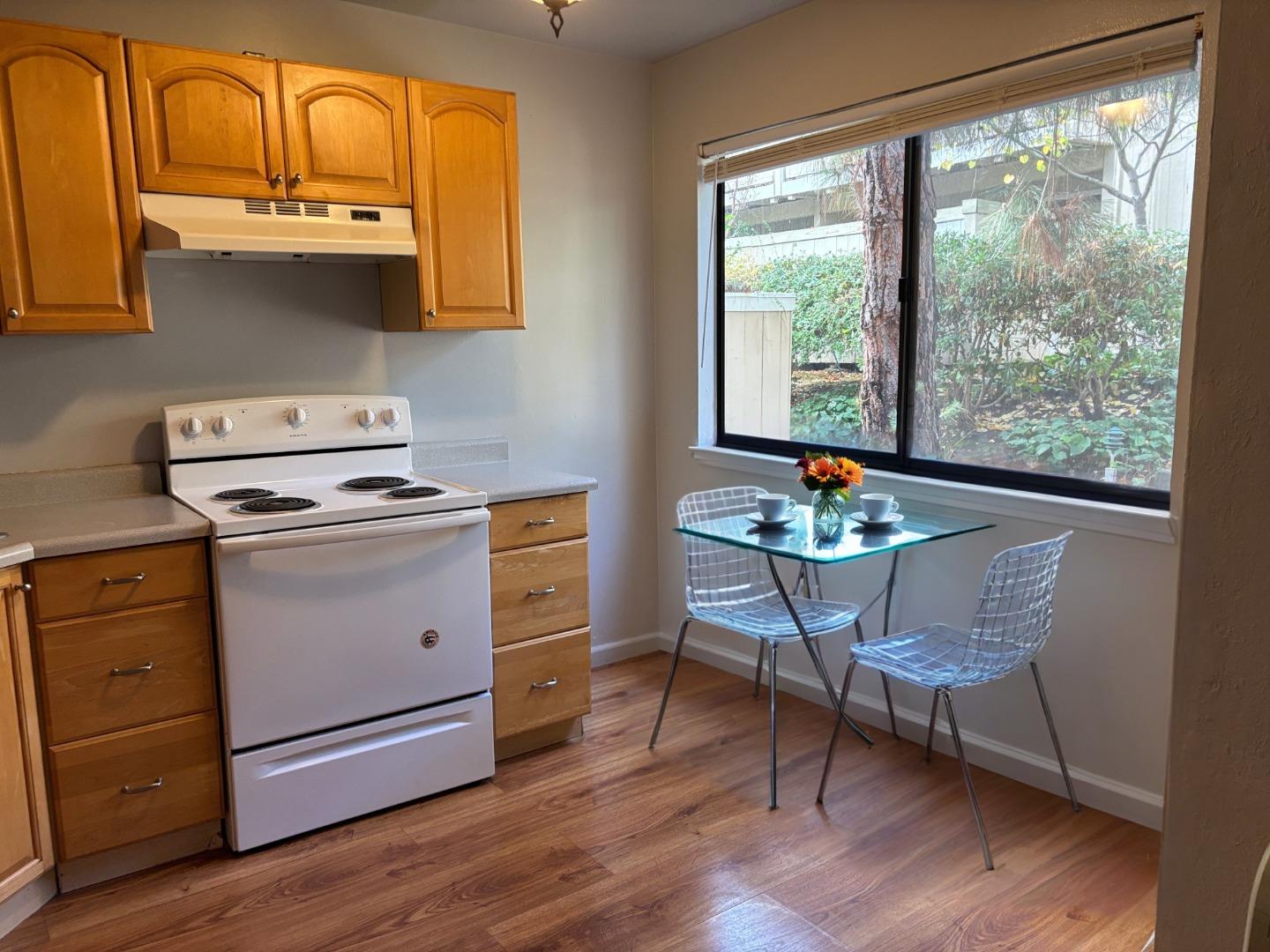 934 Kiely Boulevard, Unit B Santa Clara, CA 95051 - Photo 9 of 19 a kitchen with stainless steel appliances a stove a sink and cabinets