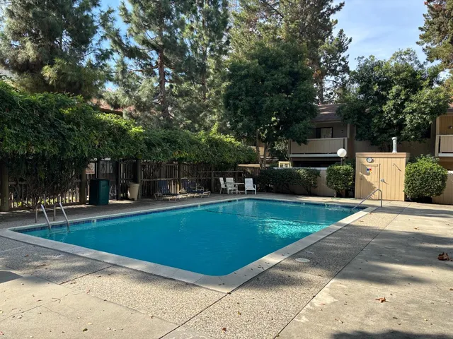 a view of a swimming pool with a patio