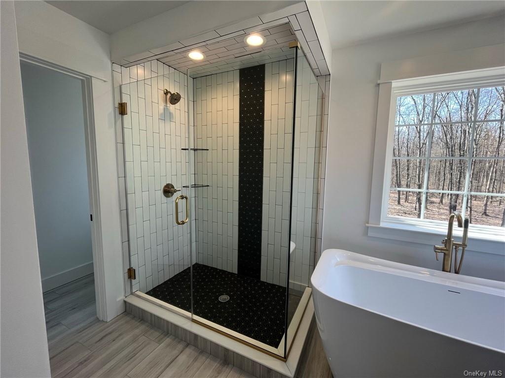 268 Lybolt Road Middletown, NY 10941 - Photo 14 of 28 a bathroom with a tub a sink and a shower