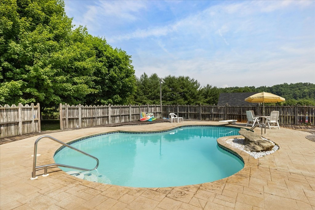 3221 Bryan Road Kodak, TN 37764 - Photo 19 of 31 a view of a swimming pool with lounge chair