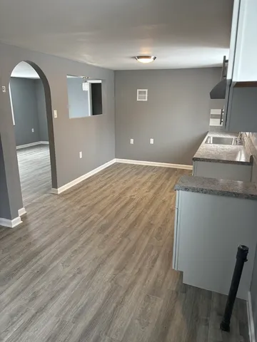 a view of a livingroom with wooden floor