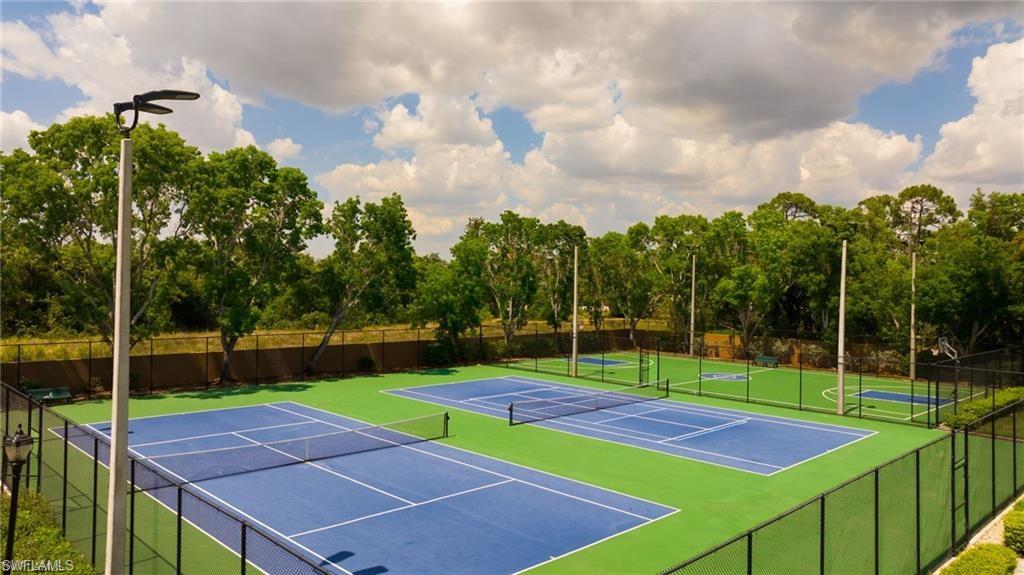 15841 Hampton View Fort Myers, FL 33908 - Photo 4 of 6 a view of a tennis ground with large trees