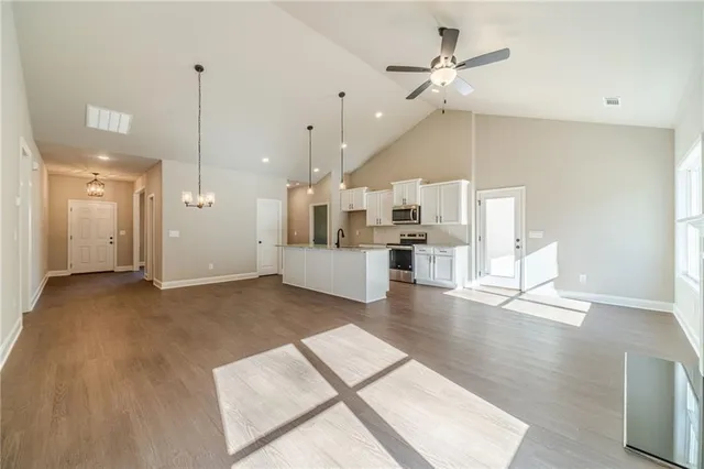 a view of a kitchen with a sink and a floor to ceiling window