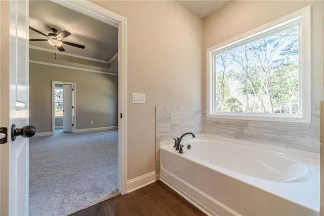 a bathroom with a bathtub and a shower