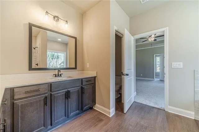 a bathroom with a double vanity sink and mirror