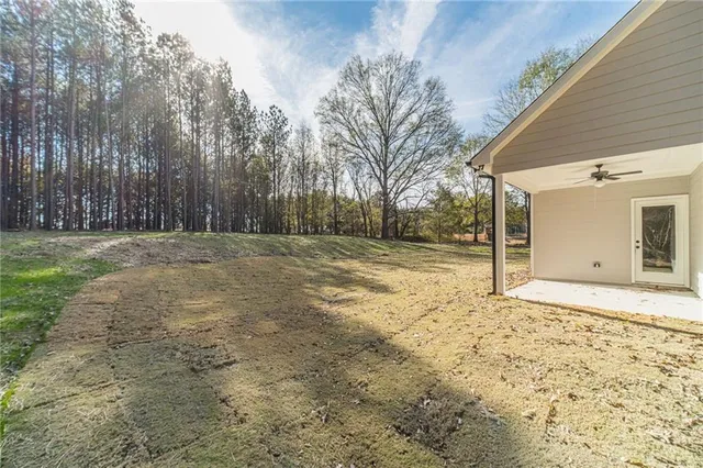 a view of a yard with a garage