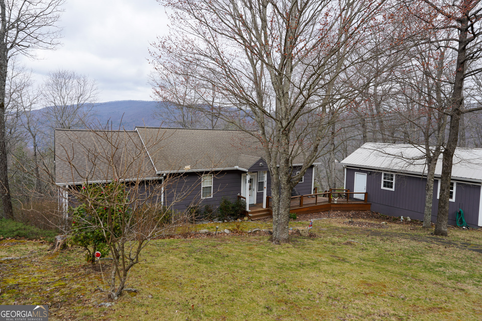 620 Courthouse Gap Road Clayton, GA 30525 - Photo 1 of 5 a view of a house with a yard covered in snow