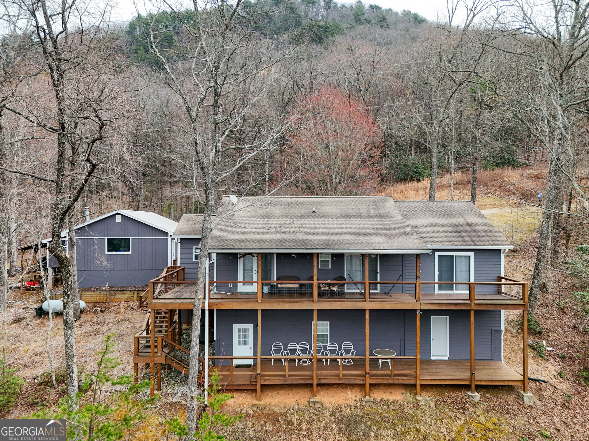 620 Courthouse Gap Road Clayton, GA 30525 - Photo 3 of 5 a front view of a house with windows and trees