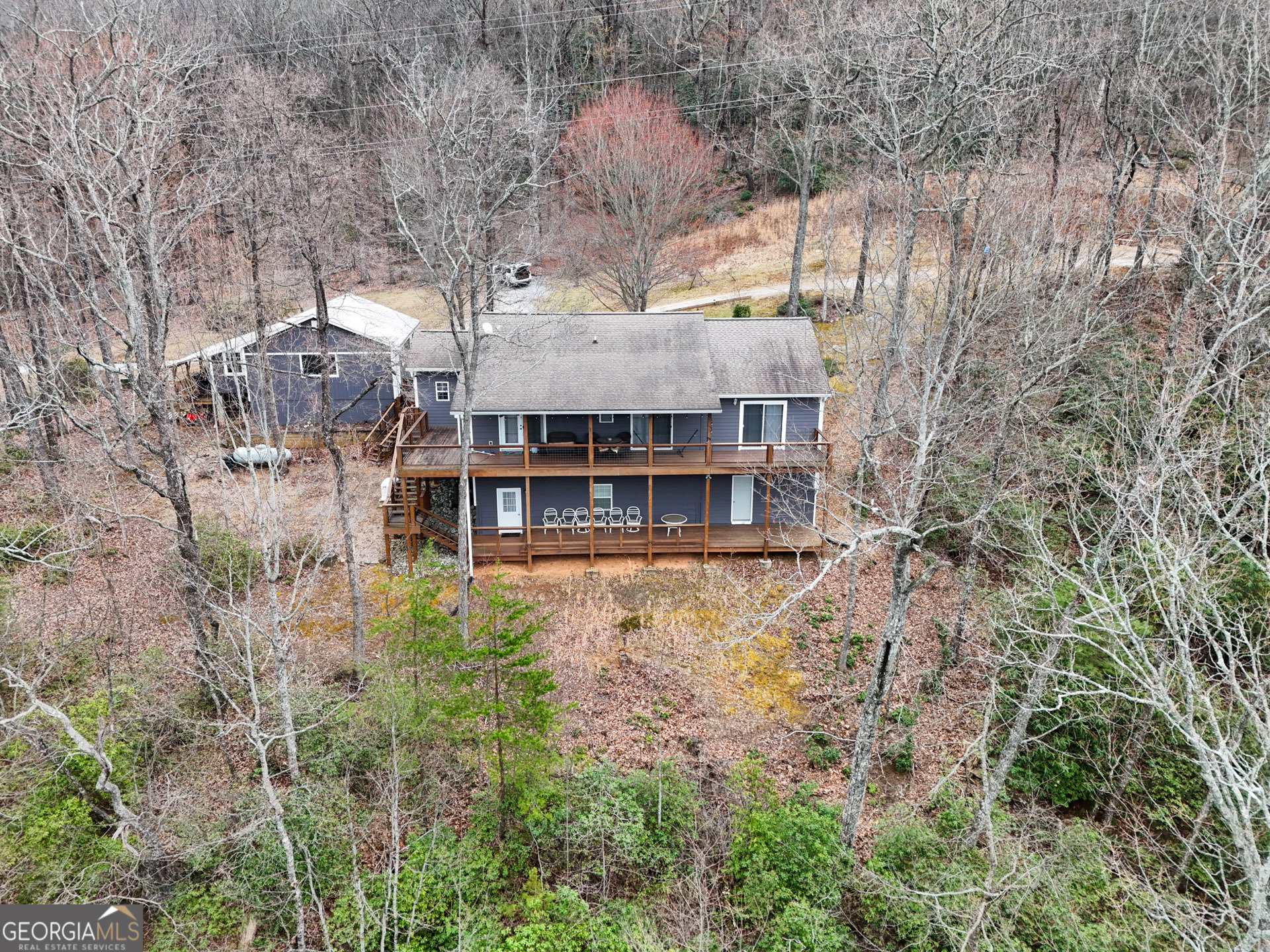 620 Courthouse Gap Road Clayton, GA 30525 - Photo 4 of 5 a view of a large house with a yard and sitting area