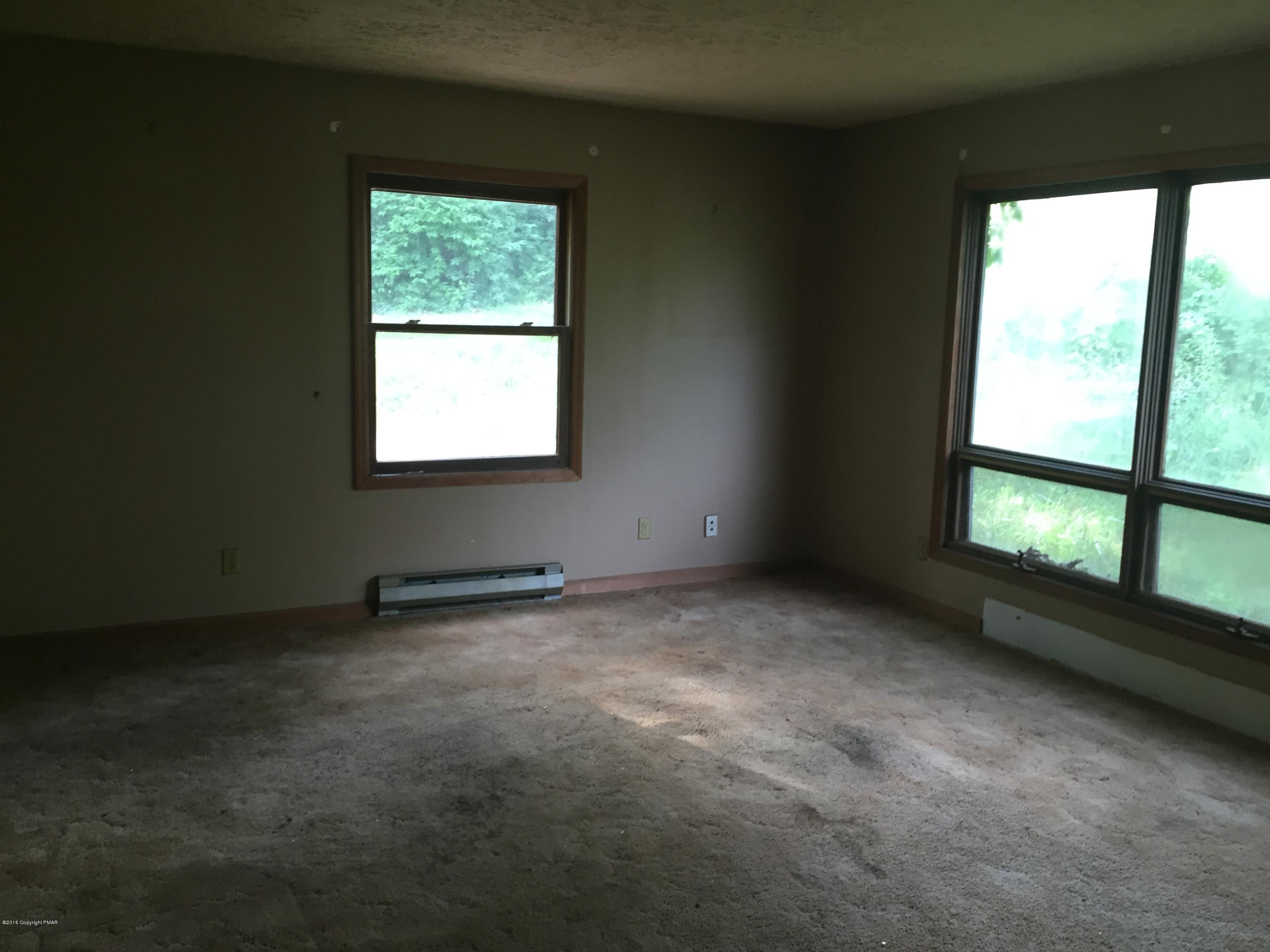 220 Lower Grandview Road Cresco, PA 18326 - Photo 3 of 10 an empty room with a window