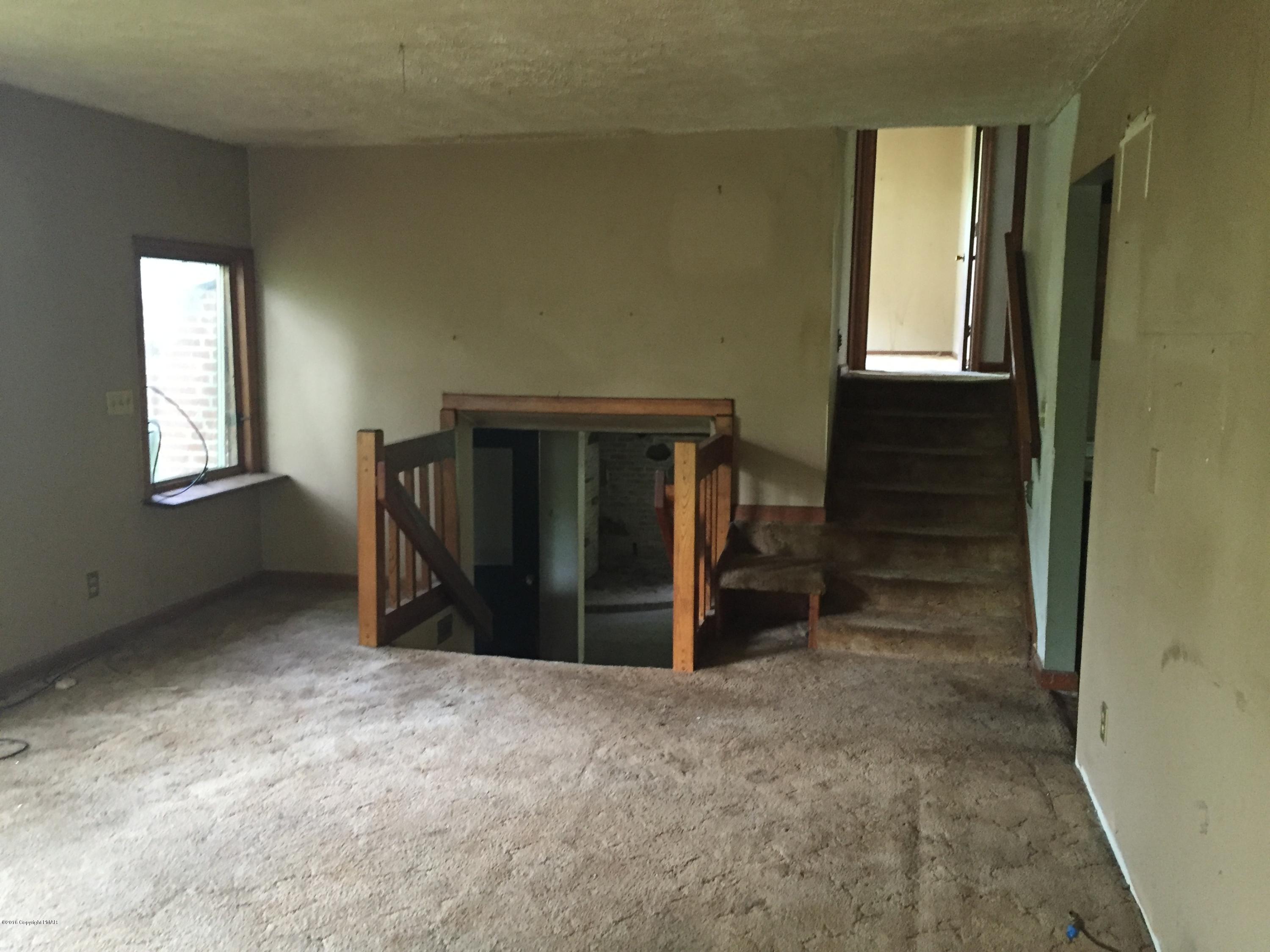 220 Lower Grandview Road Cresco, PA 18326 - Photo 4 of 10 a view of an empty room with window and closet area