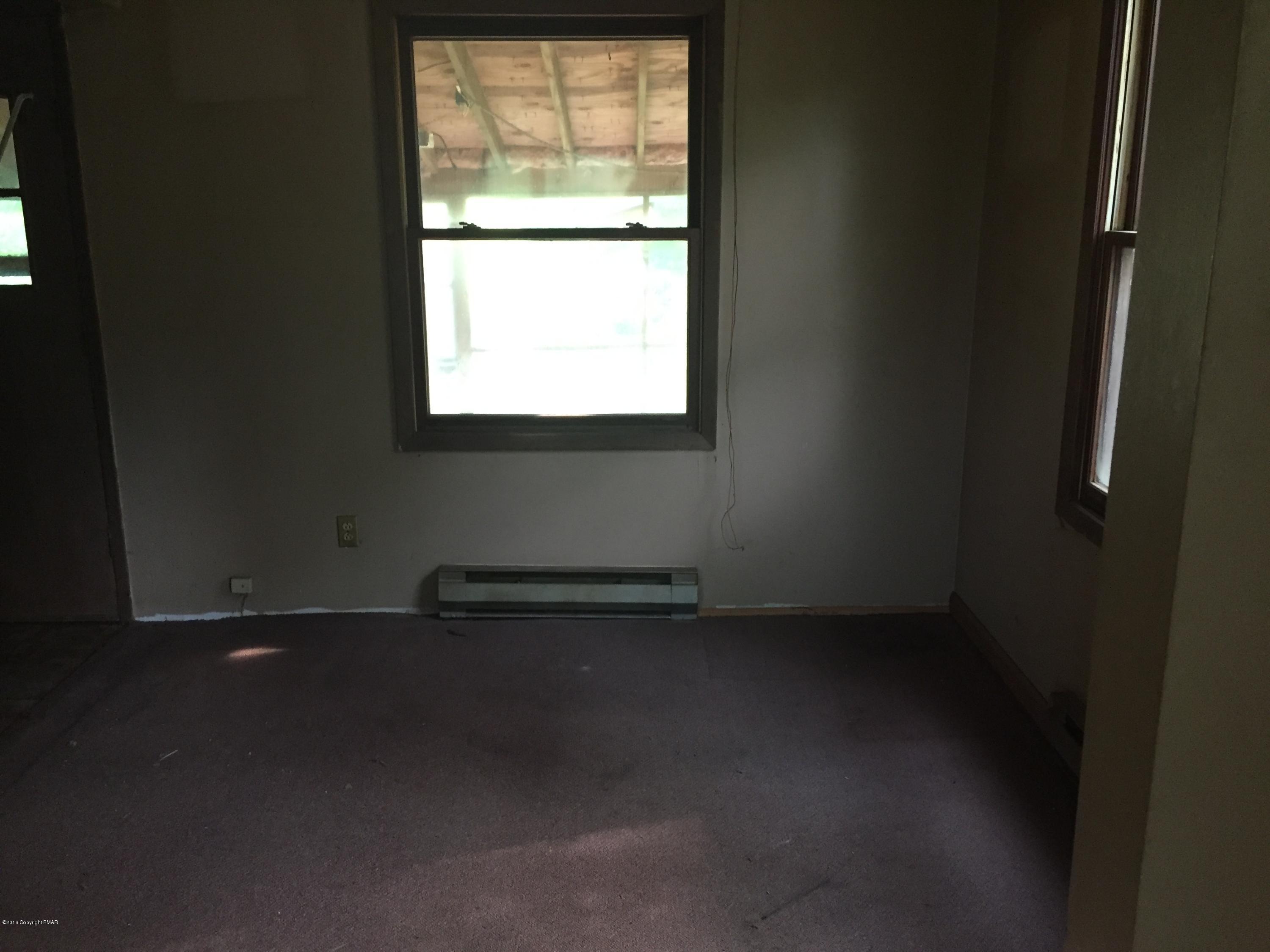 220 Lower Grandview Road Cresco, PA 18326 - Photo 5 of 10 a view of an empty room with a window