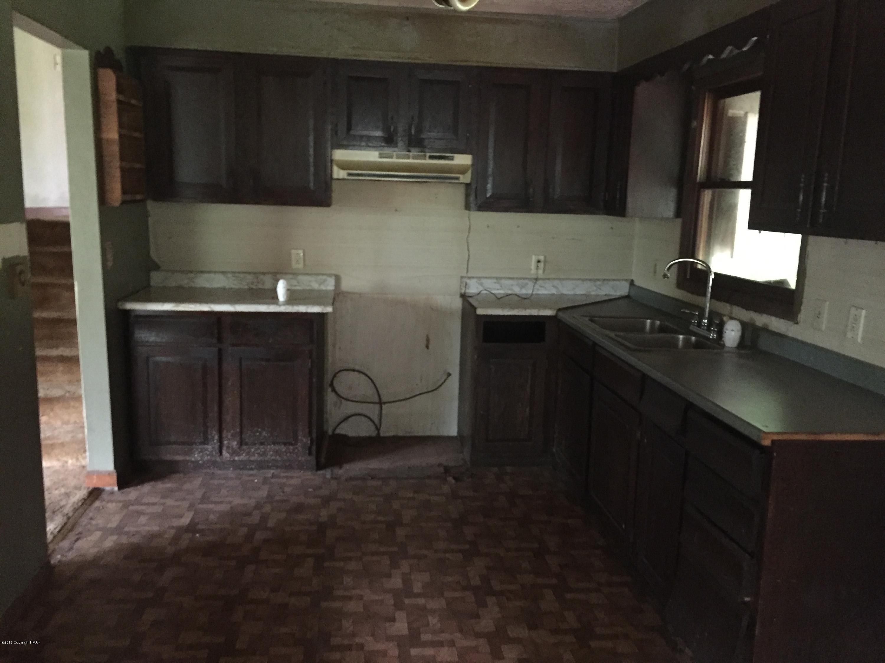 220 Lower Grandview Road Cresco, PA 18326 - Photo 6 of 10 a kitchen with a sink and cabinets