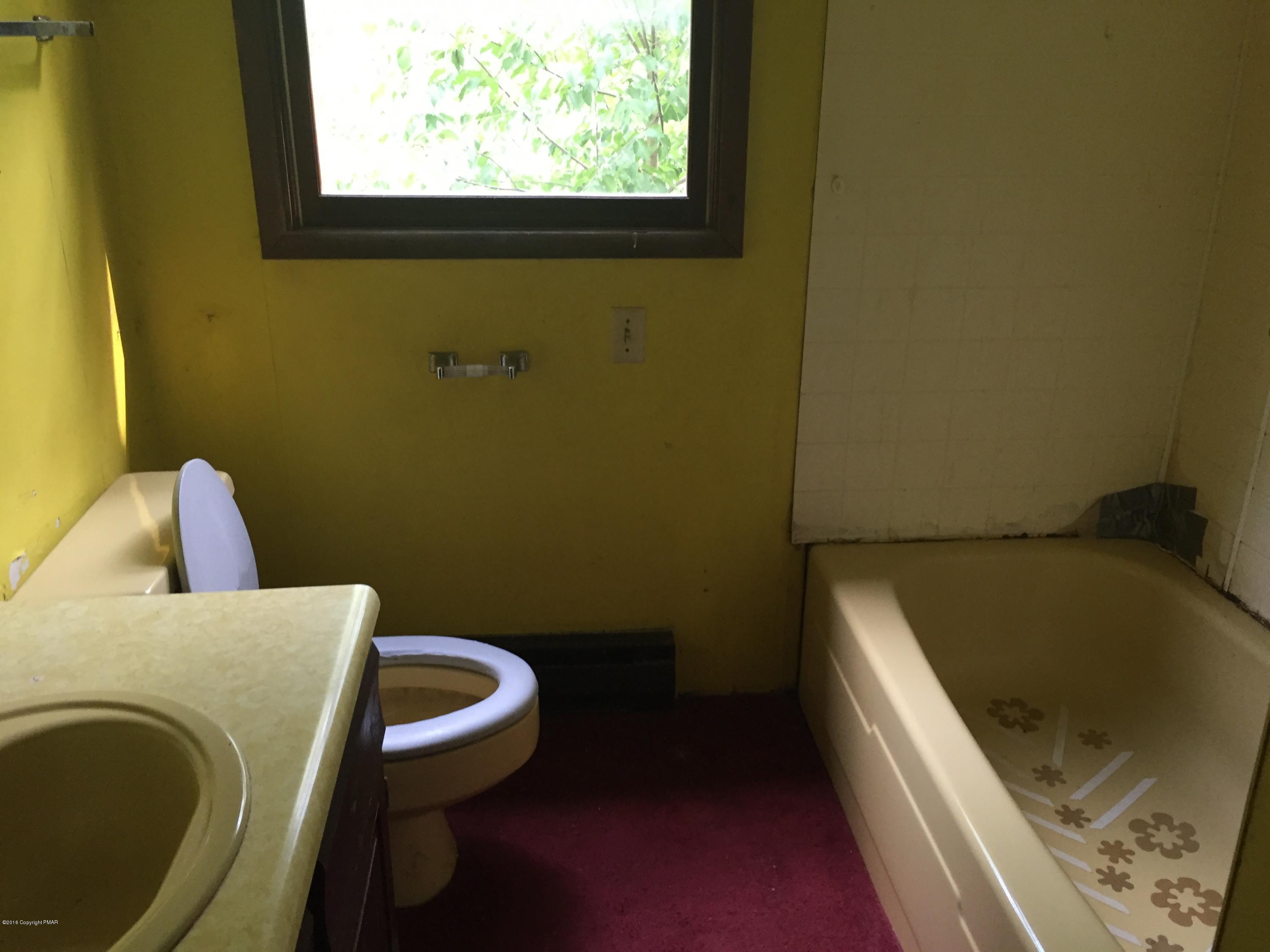 220 Lower Grandview Road Cresco, PA 18326 - Photo 7 of 10 a bathroom with a sink and toilet