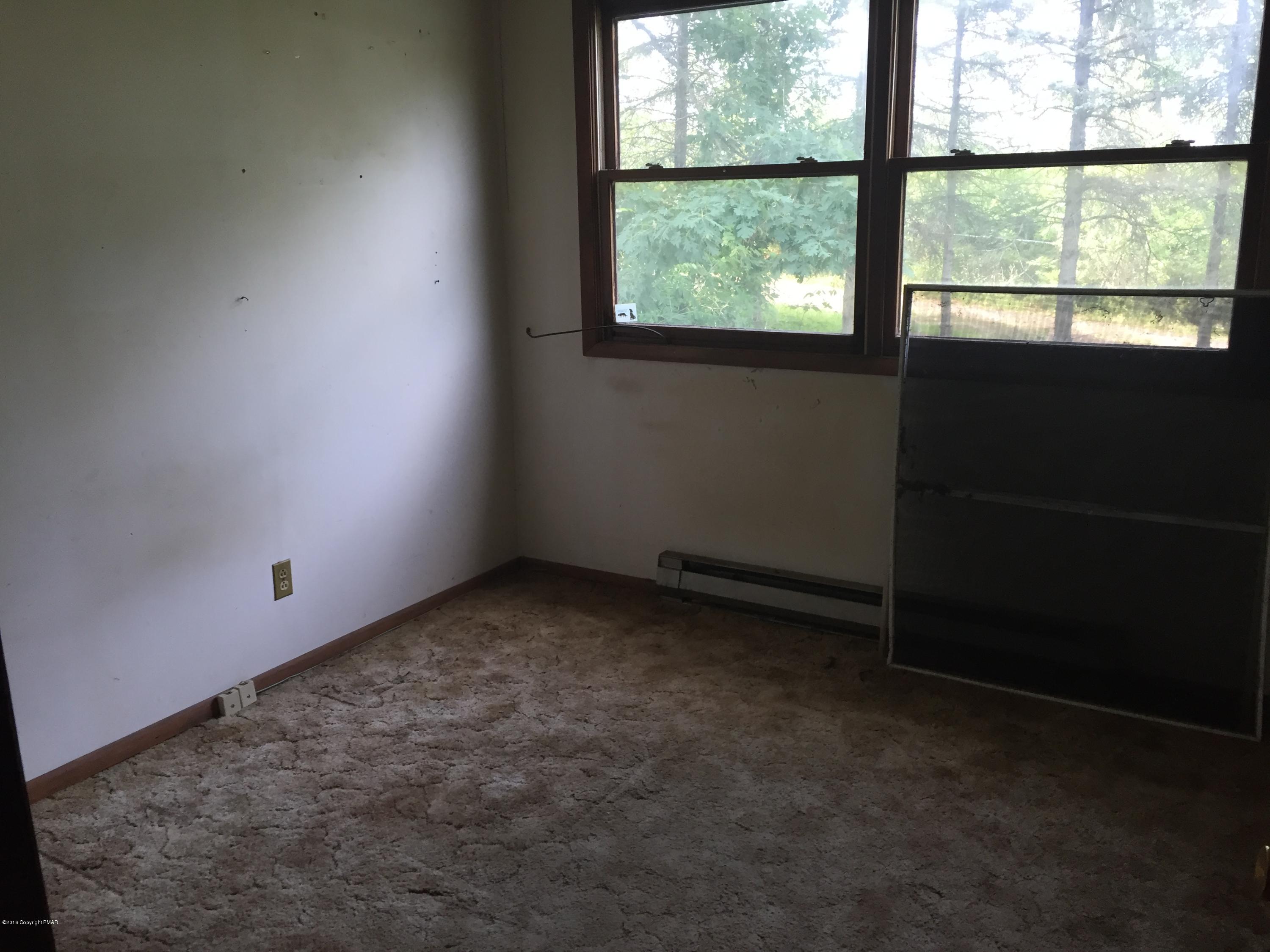220 Lower Grandview Road Cresco, PA 18326 - Photo 8 of 10 an empty room with a window