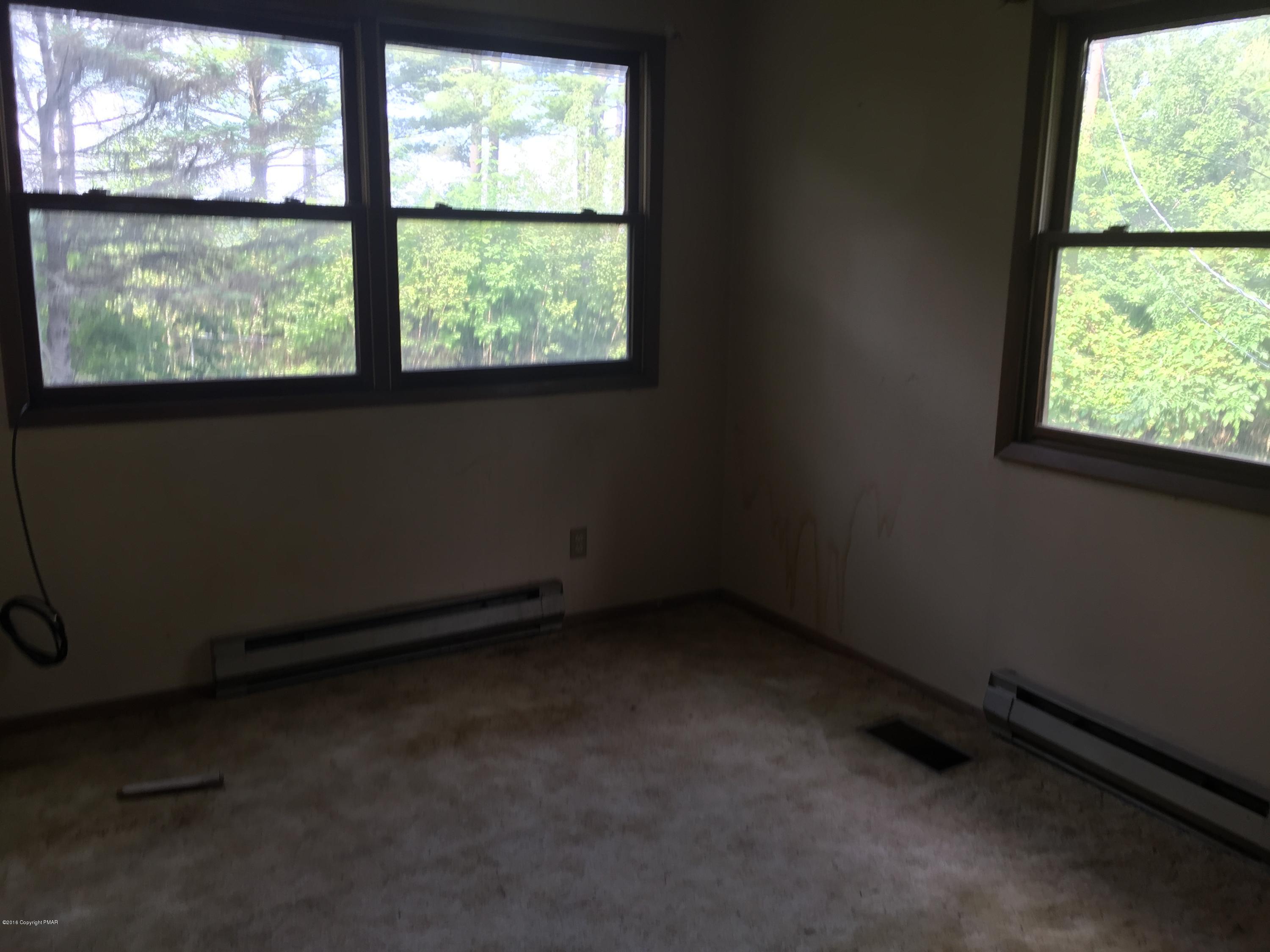 220 Lower Grandview Road Cresco, PA 18326 - Photo 9 of 10 an empty room with a window