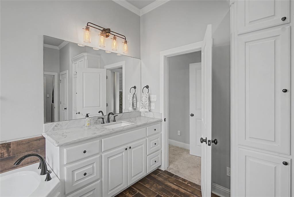 550 Ramsey Road Stonewall, LA 71078 - Photo 33 of 40 a bathroom with a granite countertop double vanity sink mirror and