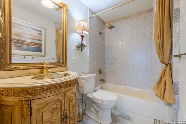 a bathroom with a sink a toilet and a bathtub