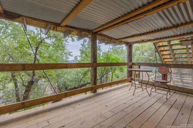 a view of a room with wooden floor and outdoor space