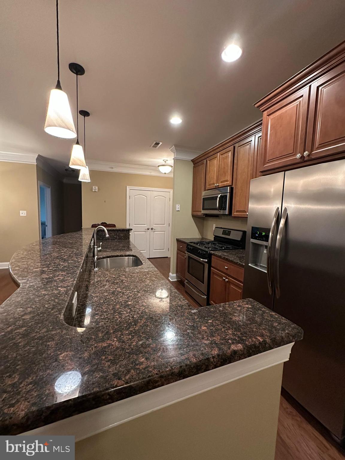 756 Street Road, Unit 17 Southampton, PA 18966 - Photo 14 of 31 a kitchen with stainless steel appliances granite countertop a sink a stove and a refrigerator