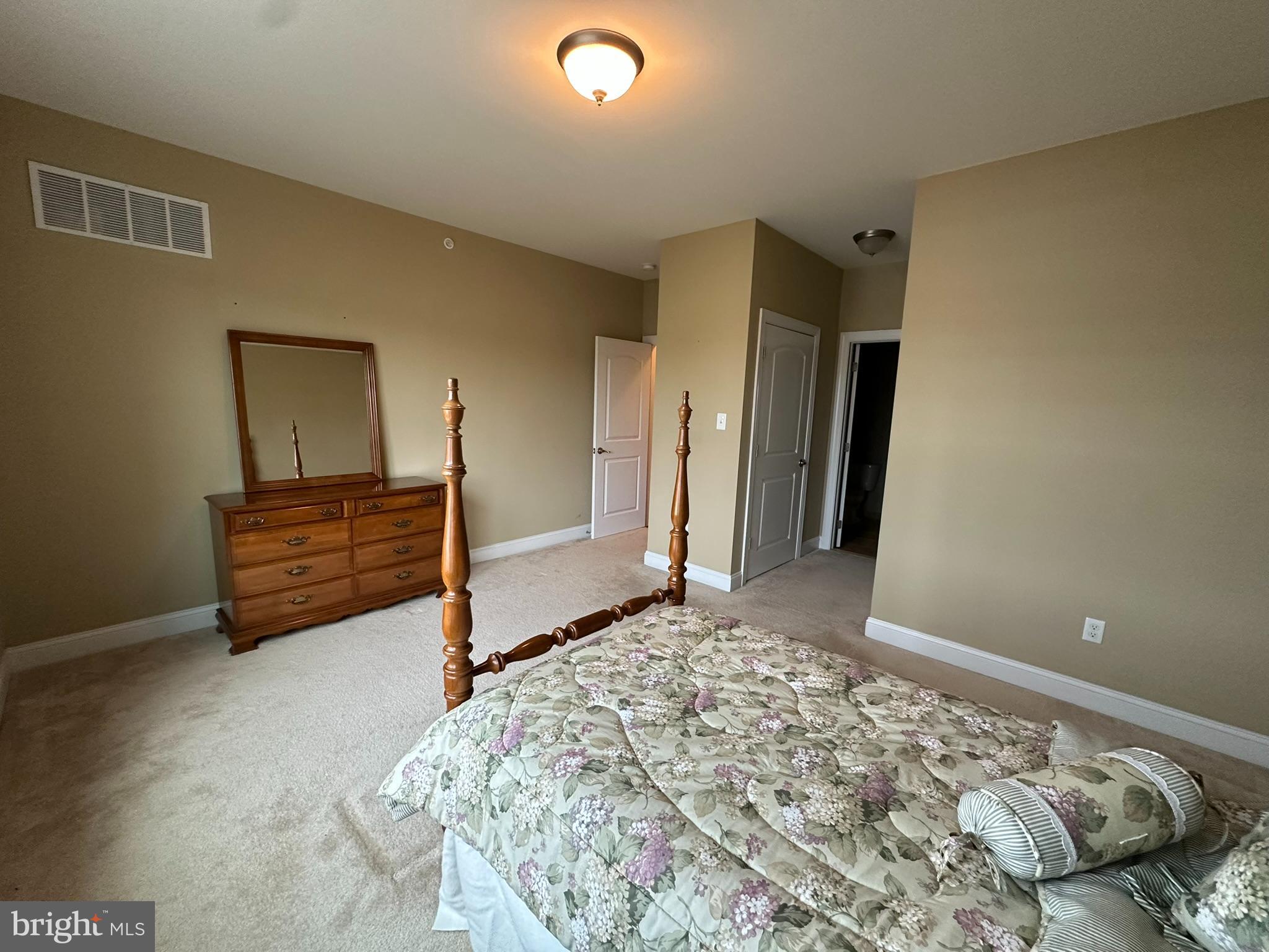 756 Street Road, Unit 17 Southampton, PA 18966 - Photo 17 of 31 a bedroom with a bed and a dresser