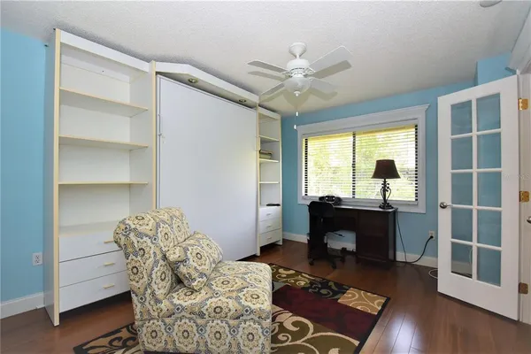 a bedroom with furniture and a window