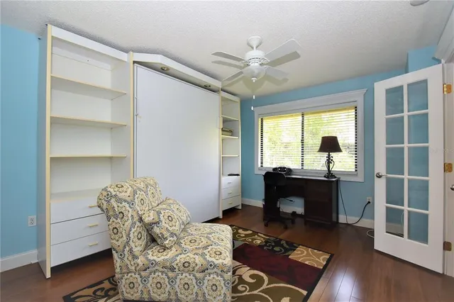 a bedroom with furniture and a window