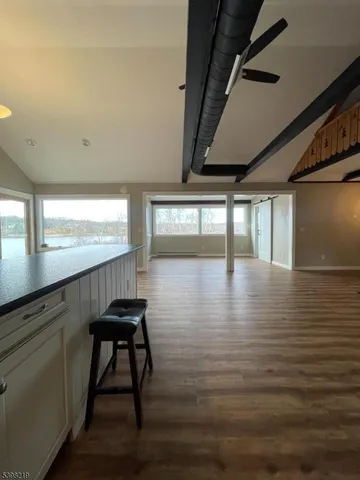 a room with wooden floor and furniture