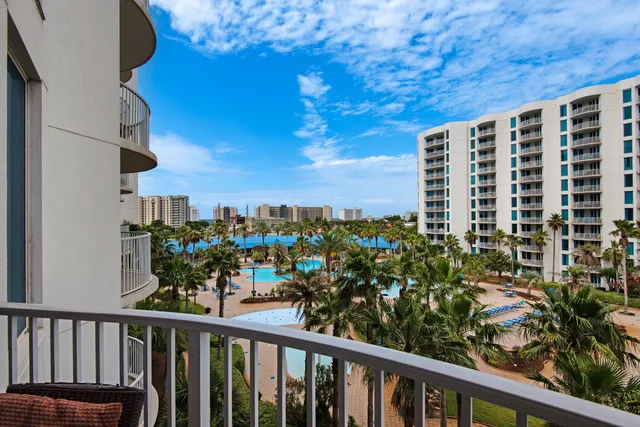 a view of balcony with furniture