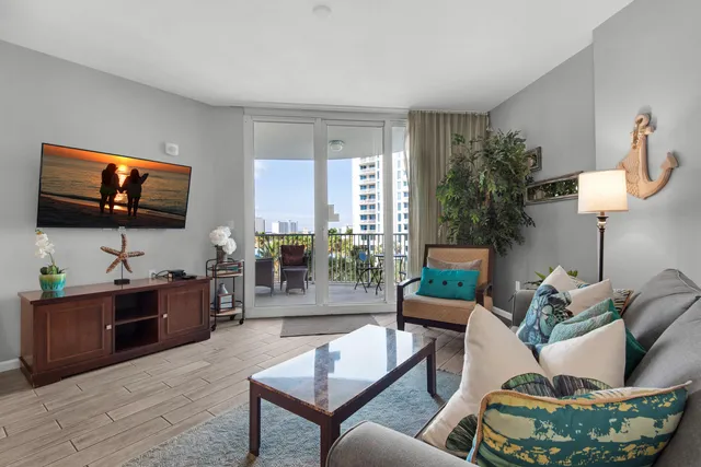 a living room with furniture and a lamp