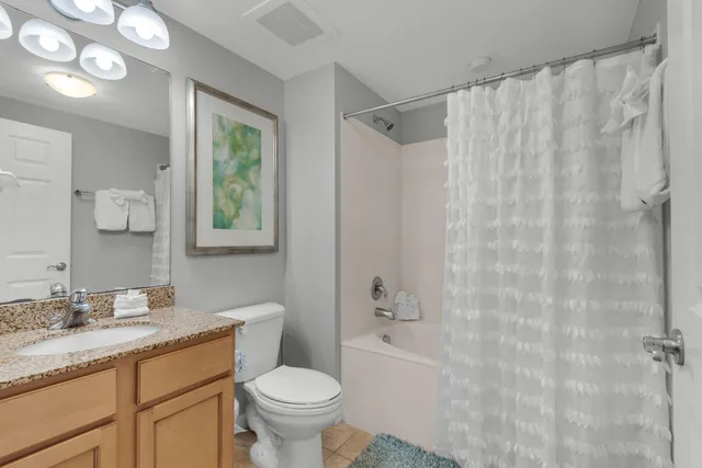 a balcony with a bench and city view