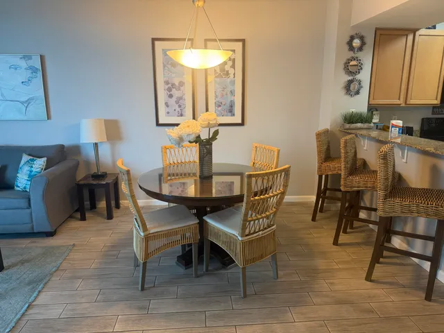 a view of a dining room with furniture and wooden floor