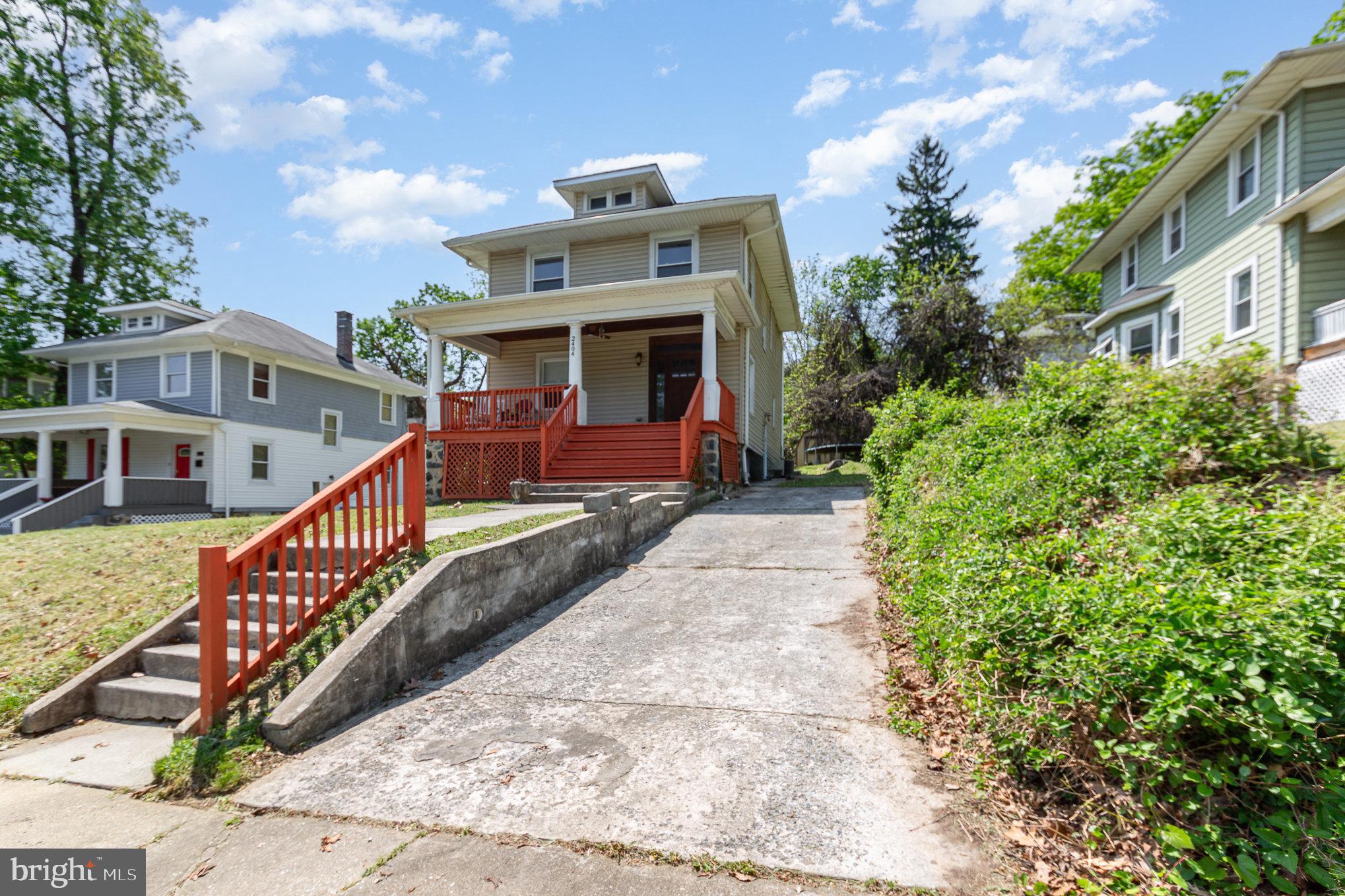 2404 Allendale Road Baltimore, MD 21216 - Photo 2 of 30 a front view of a house with garden
