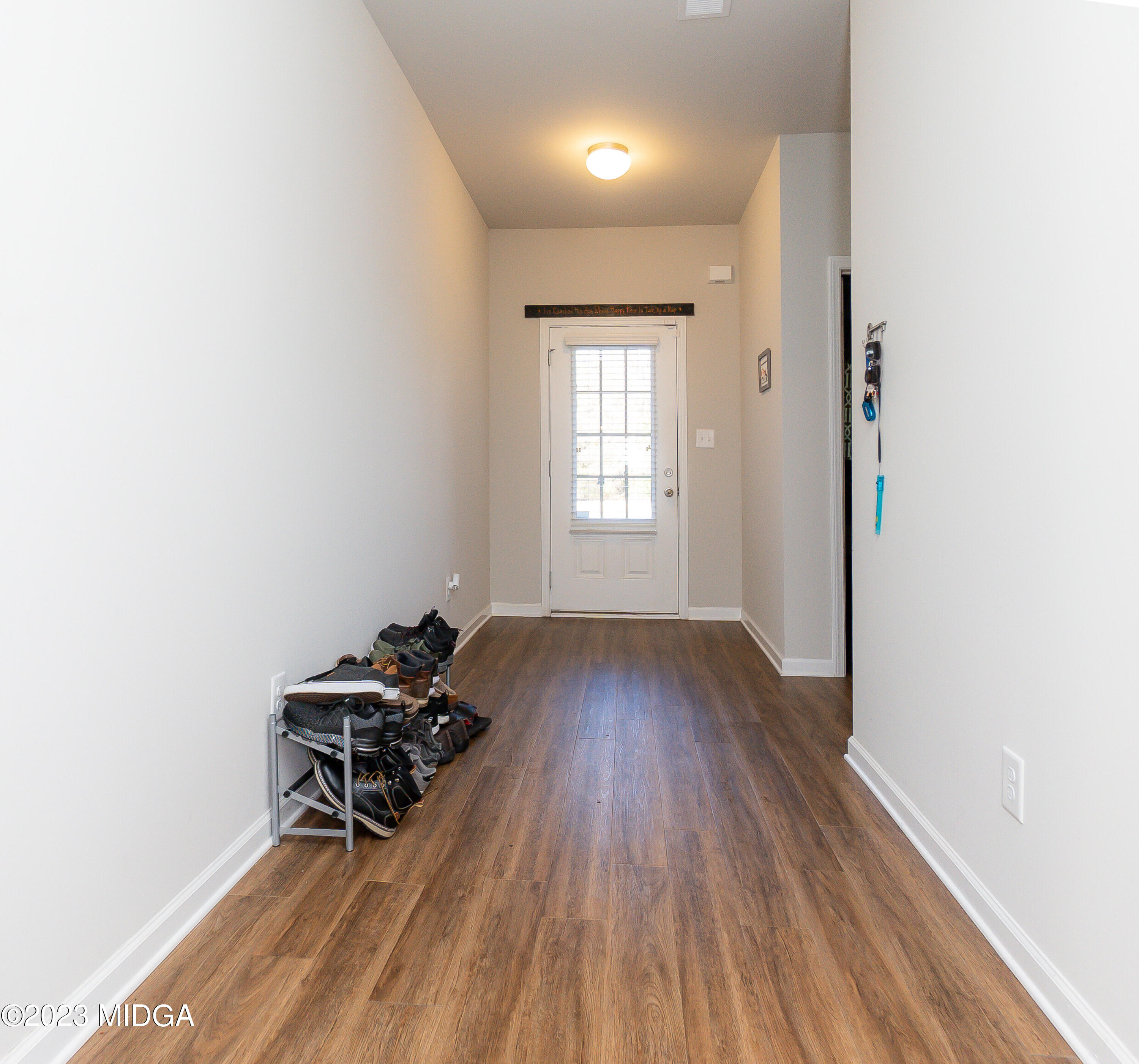 103 Longbridge Way Perry, GA 31069 - Photo 3 of 53 an empty room with wooden floor and a window