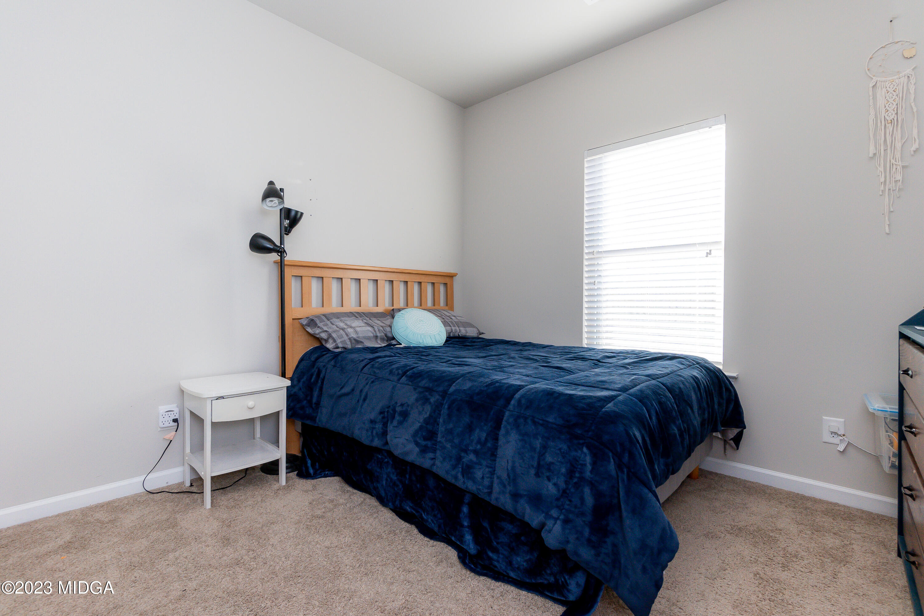 103 Longbridge Way Perry, GA 31069 - Photo 40 of 53 a bedroom with a bed and a window