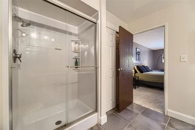 a en suite bathroom with a glass shower door