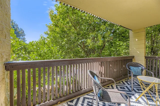 a view of a balcony with wooden floor