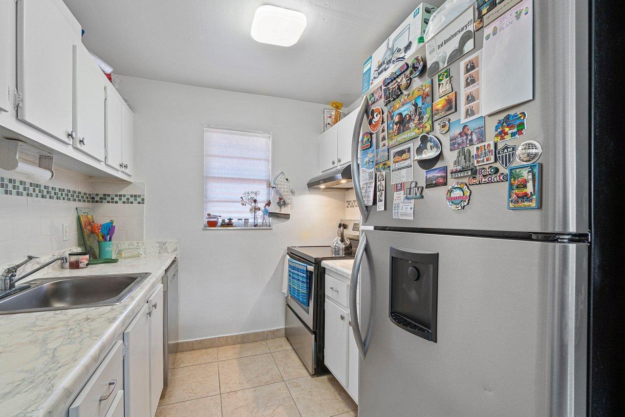 600 Southwest 2nd Street, Unit 2390 Boca Raton, FL 33486 - Photo 13 of 18 a utility room with sink dryer and washer