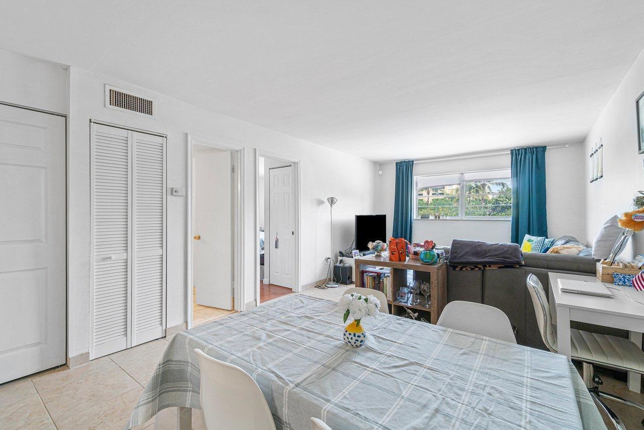 600 Southwest 2nd Street, Unit 2390 Boca Raton, FL 33486 - Photo 7 of 18 a view of a dining room with furniture and a window