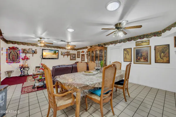 a living room with furniture and flat screen tv