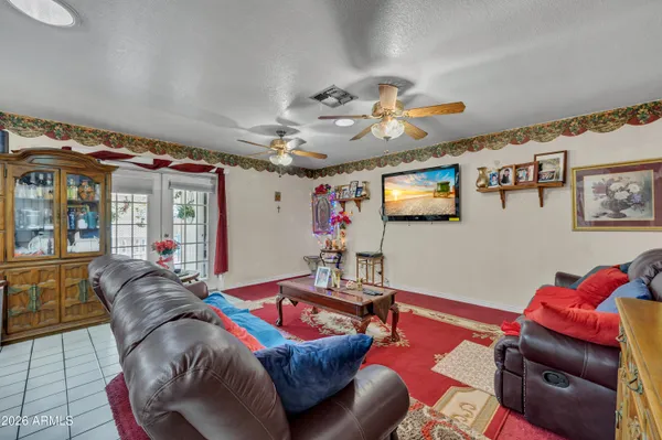 a living room with lots of furniture and kitchen view