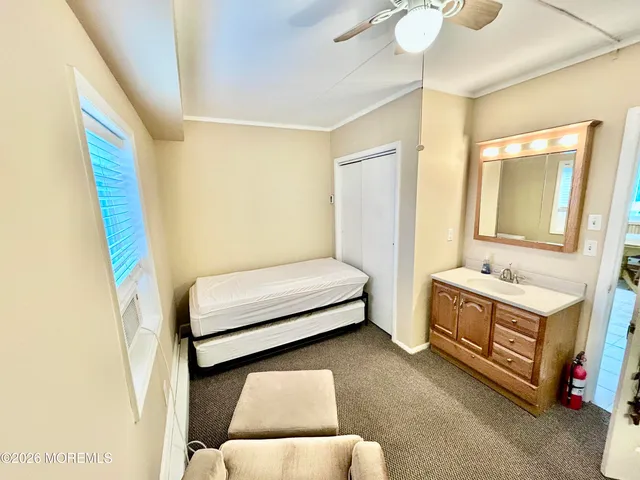 a bedroom with a bed and a dresser