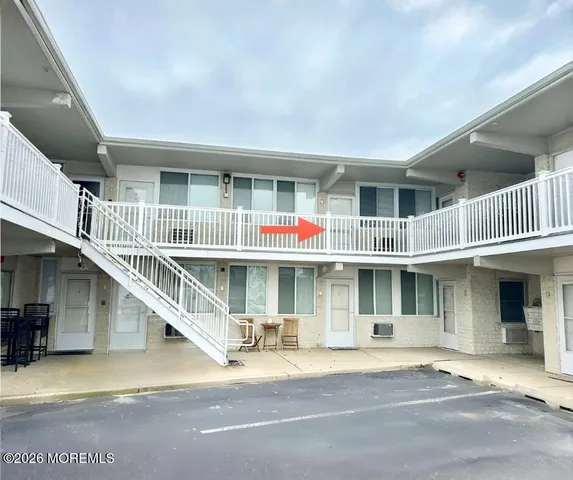 a front view of residential houses with stairs