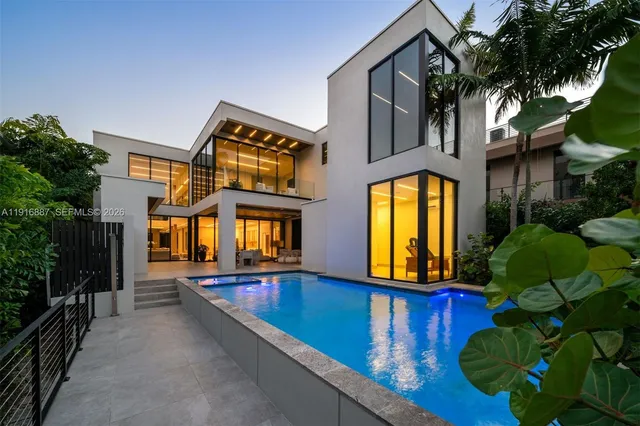 a view of a building with a tub and porch windows