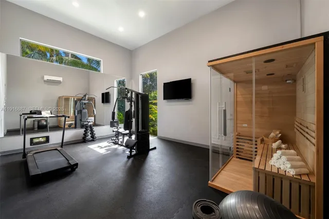 a view of a livingroom with furniture and a flat screen tv