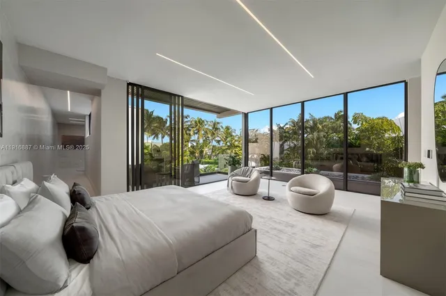 a bedroom with furniture and a potted plant