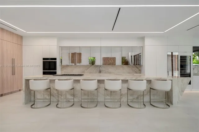 a kitchen with a table and chairs in it