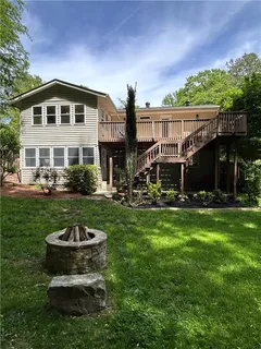 a front view of a house with a yard table and chairs